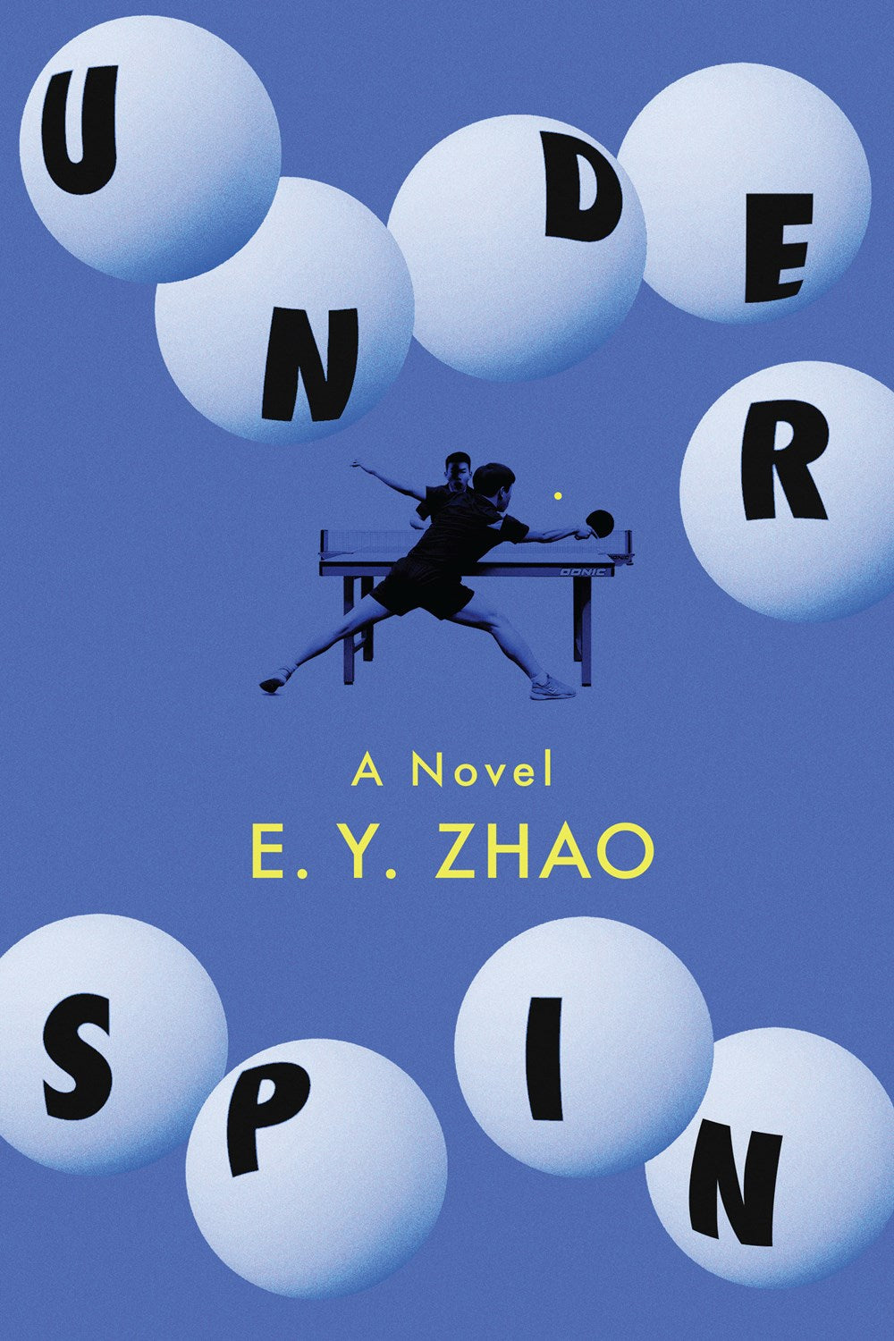 Signed & personalized Underspin by EY Zhao from Yu & Me Books—a table tennis novel. The cover features large white ping pong balls spelling UNDER SPIN, two players in the center, all on a blue background.