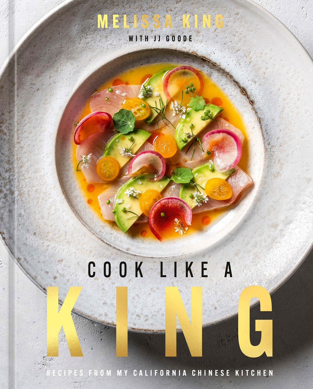 The cover of Cook Like a King by Melissa King (with Signed Bookplate!) from Yu & Me Books showcases a vibrant dish with sliced fish, radishes, herbs, and edible flowers inspired by Chinese California recipes.