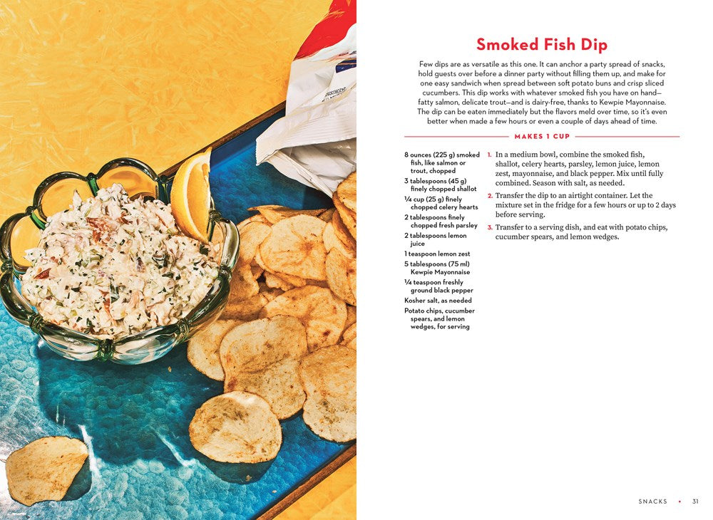 A bowl of smoked fish dip with creamy Kewpie Mayonnaise sits on a blue tray with chips, cucumbers, and lemon—recipe from *For the Love of Kewpie* by Elyse Inamine & Jessie YuChen (Signed & Personalized) at Yu & Me Books.